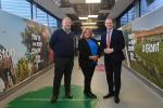 Economy Minister Gordon Lyons is pictured with Belfast International Airport Managing Director Graham Keddie, and Ainsley McWilliams, Tourism NI, at the recently revamped domestic arrivals corridor at Belfast International Airport.
