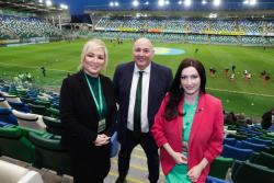 First Minister, Michelle O'Neill (left) with deputy First Minister, Emma Little-Pengelly and Irish Football Association President, Conrad Kirkwood at Windsor Park before the start of the senior women's match this evening.