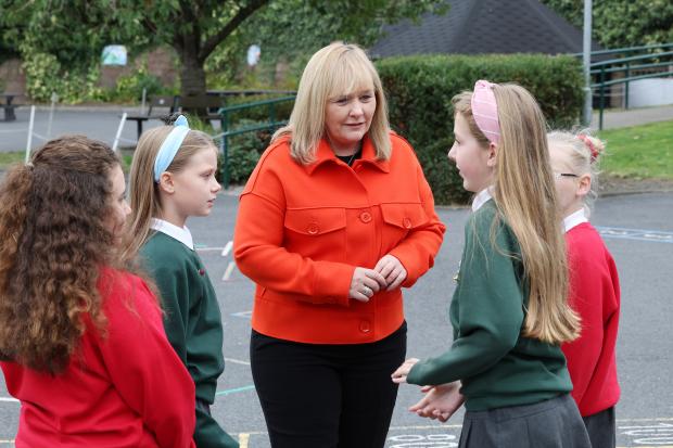 Minister with pupils at the launch of the Shared Education Strategy
