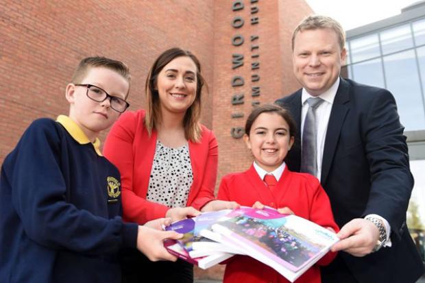 Junior Ministers pictured with pupils outside Girdwood Community Hub