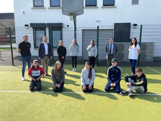 unior Minister Gary Middleton pictured with youth worker, Adam Taylor; Michael Hogg, Education Authority; and young people who took part in the Planned Interventions Projects.