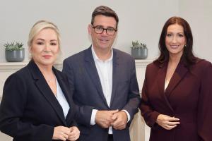 Image of three people - The First Minister Michelle O’Neill and deputy First Minister Emma Little-Pengelly are pictured with Prime Minister Andy Burnham